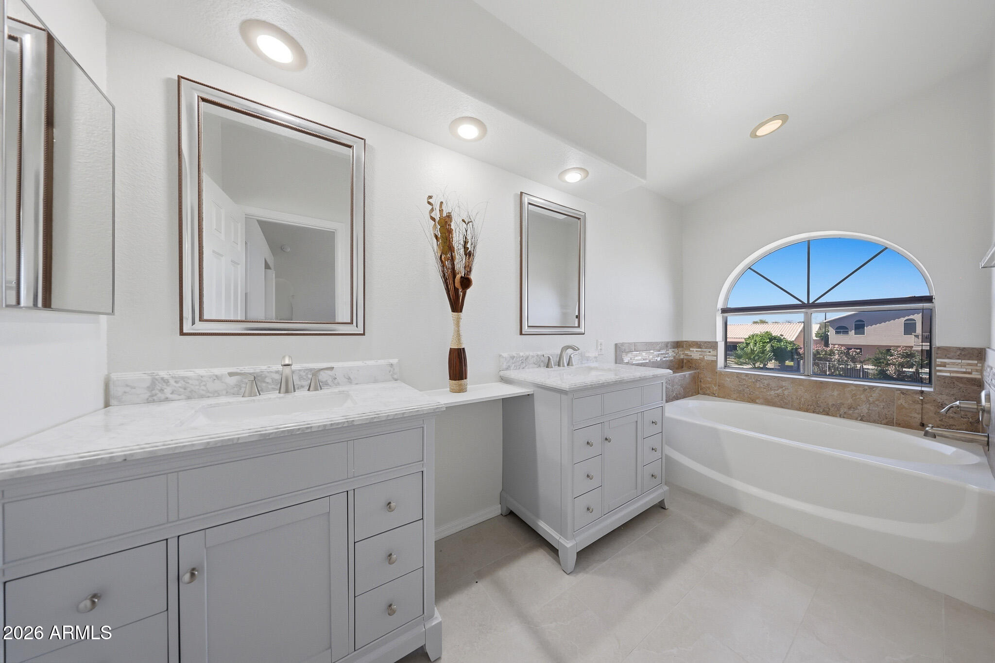 648 South Cholla Street Gilbert, AZ 85233 - Photo 22 of 46 a bathroom with a sink double vanity mirror and a bathtub