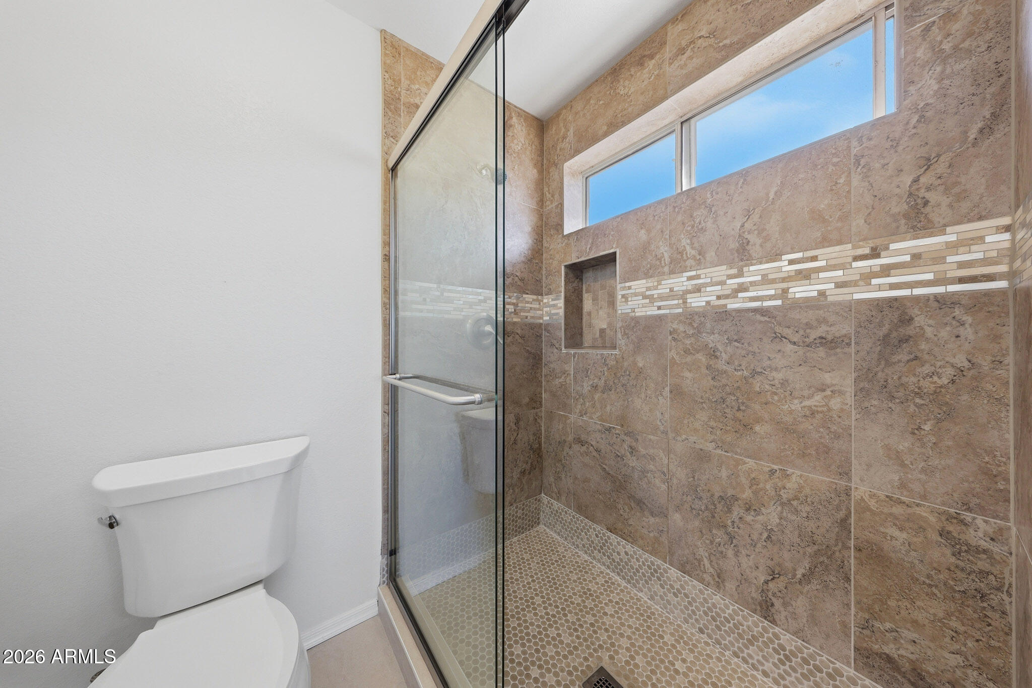 648 South Cholla Street Gilbert, AZ 85233 - Photo 25 of 46 a bathroom with a toilet and a shower