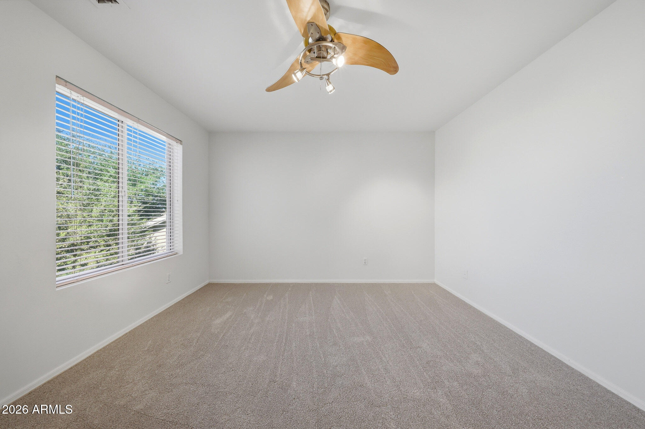 648 South Cholla Street Gilbert, AZ 85233 - Photo 31 of 46 an empty room with a window