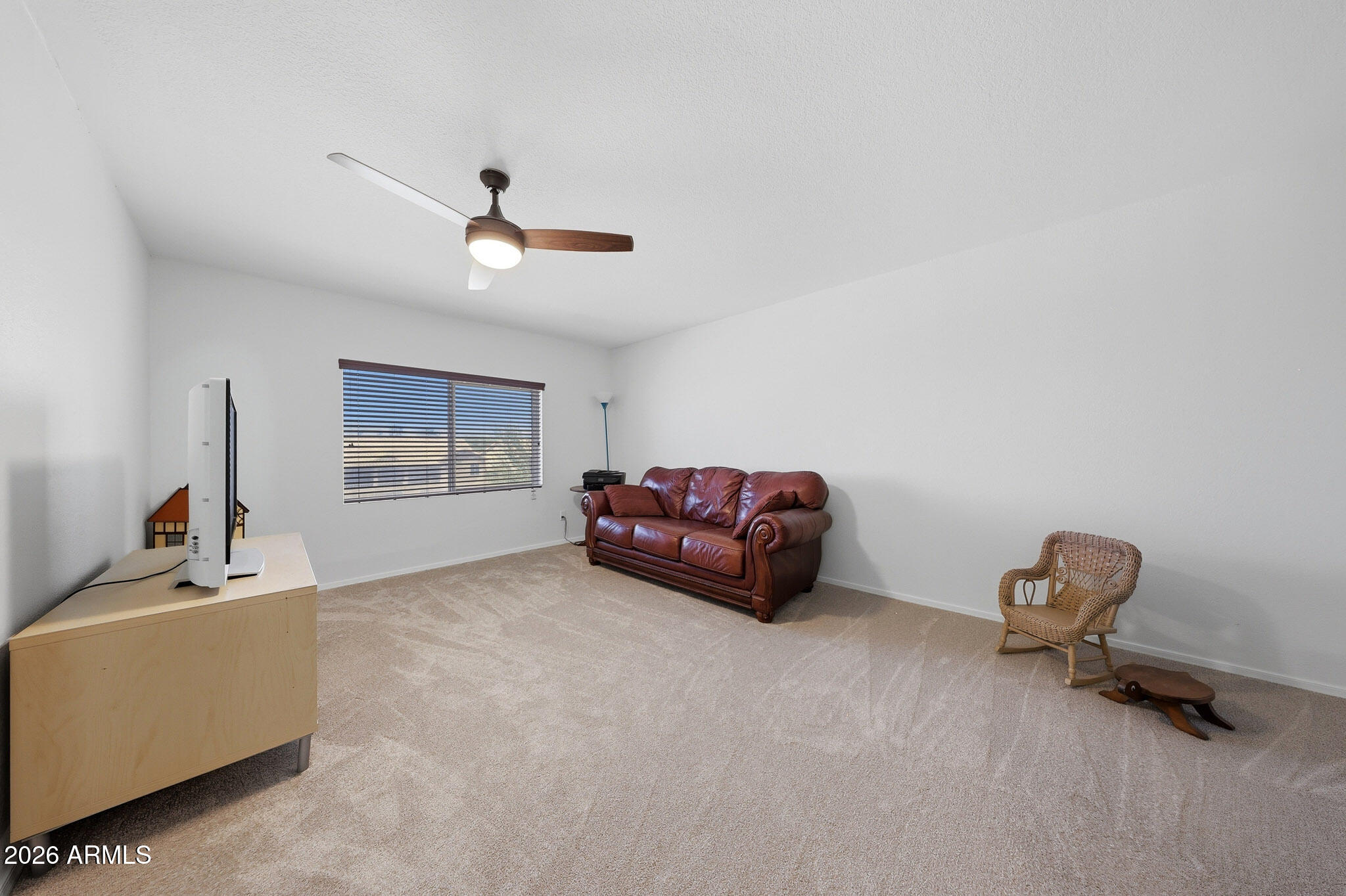 648 South Cholla Street Gilbert, AZ 85233 - Photo 34 of 46 a living room with furniture and a ceiling fan