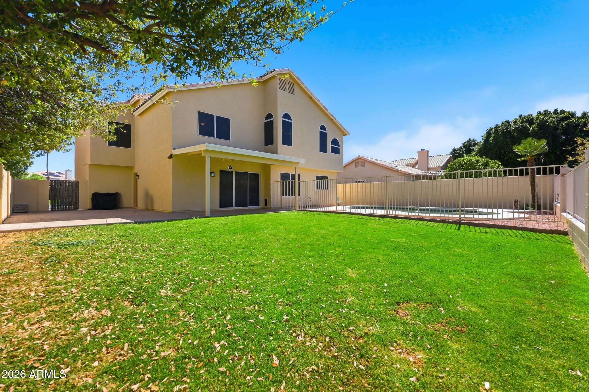 648 South Cholla Street Gilbert, AZ 85233 - Photo 40 of 46 a front view of house with yard and green space