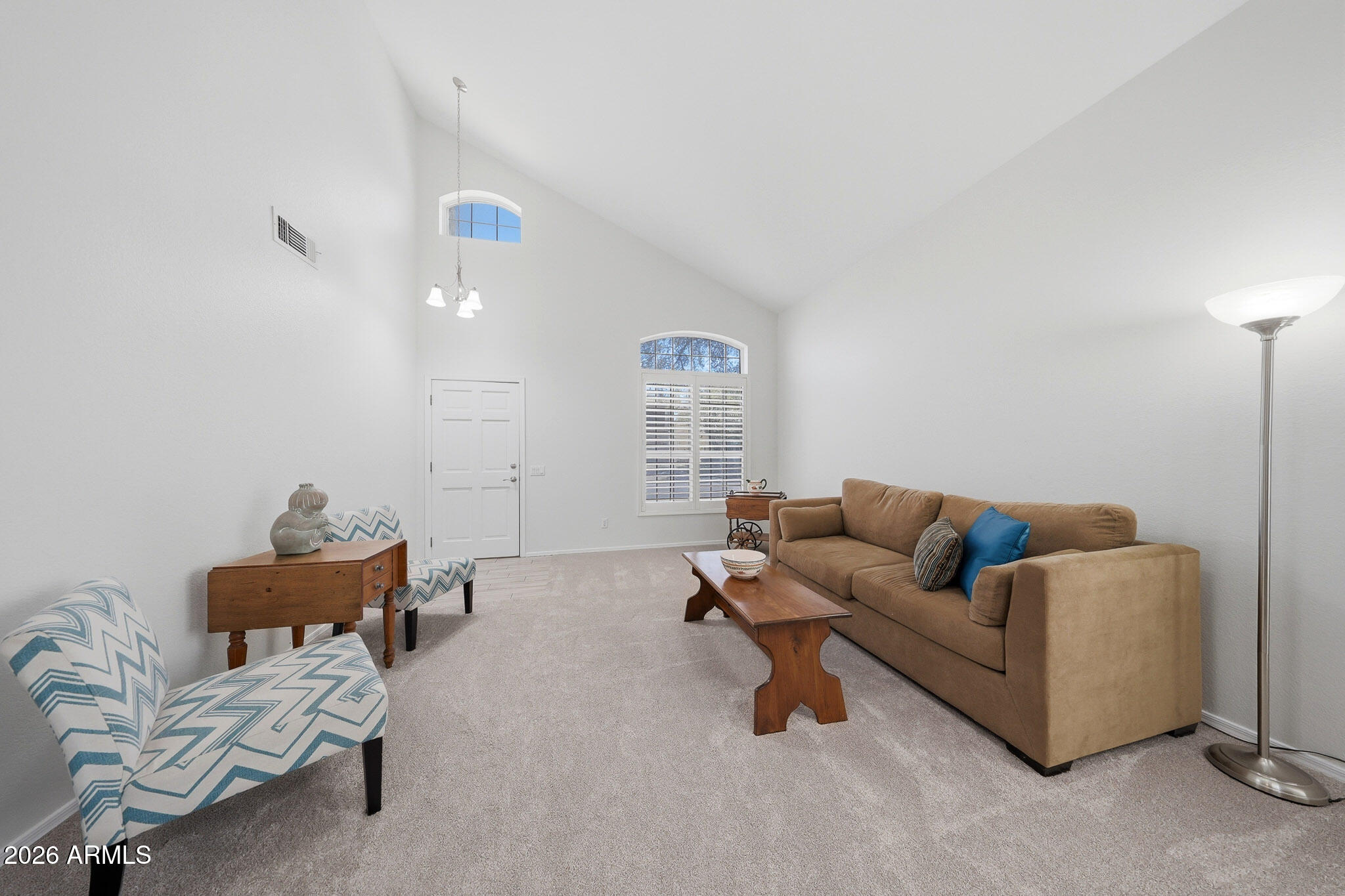 648 South Cholla Street Gilbert, AZ 85233 - Photo 4 of 46 a living room with furniture and a window