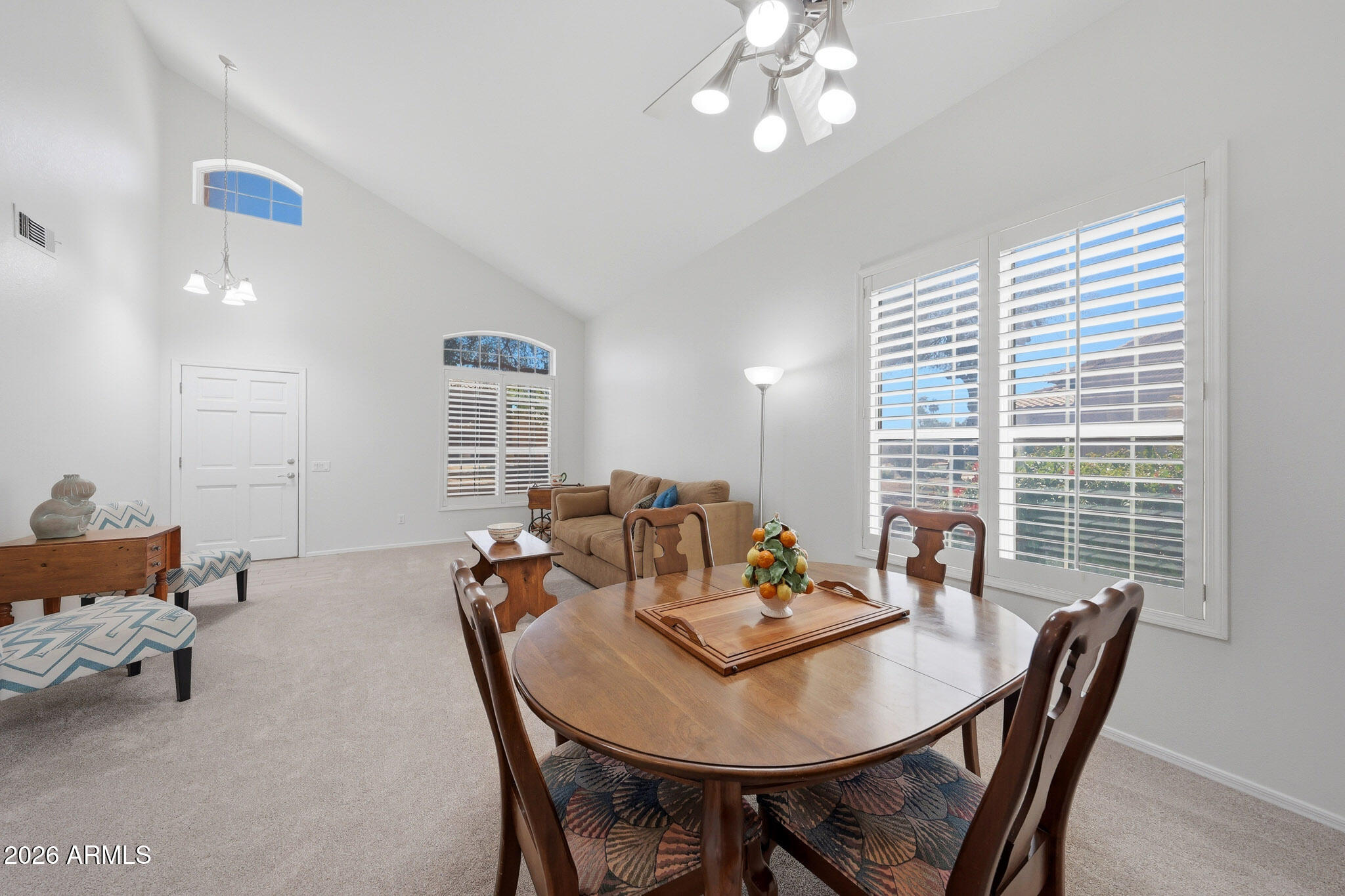 648 South Cholla Street Gilbert, AZ 85233 - Photo 5 of 46 a view of a dining room with furniture and window