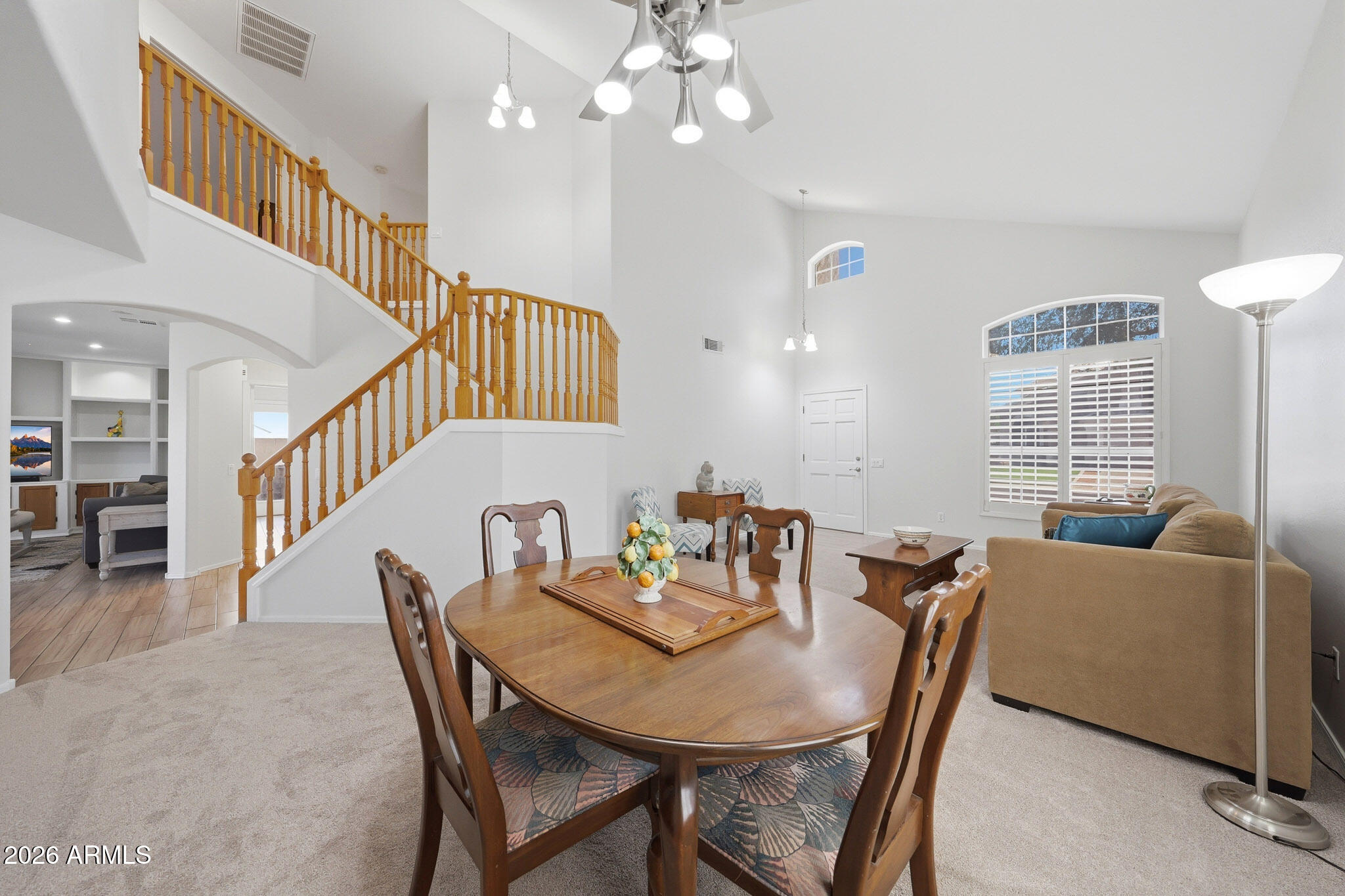 648 South Cholla Street Gilbert, AZ 85233 - Photo 6 of 46 a view of a dining room with furniture and a chandelier