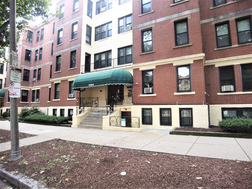 1404 Commonwealth Avenue, Unit 7 Boston, MA 02135 - Photo 18 of 19 a view of a brick building next to a road