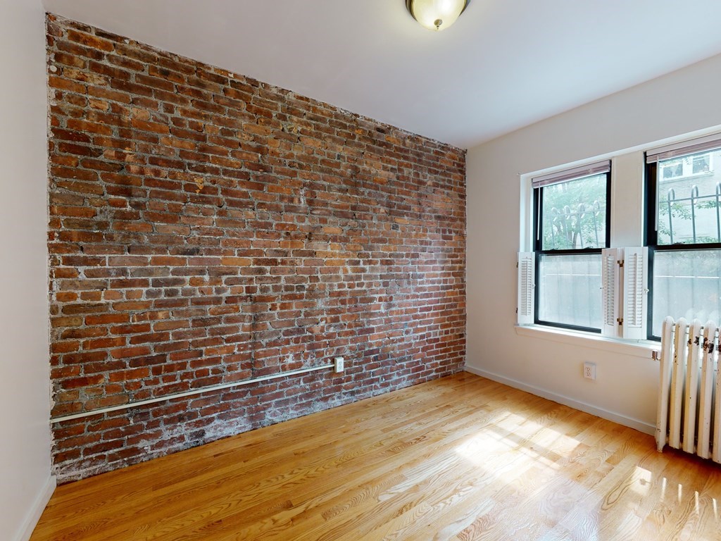 1404 Commonwealth Avenue, Unit 7 Boston, MA 02135 - Photo 2 of 19 a view of an empty room and window