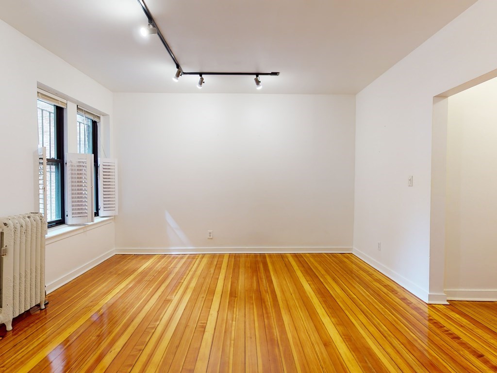 1404 Commonwealth Avenue, Unit 7 Boston, MA 02135 - Photo 9 of 19 a view of a room with wooden floor and small space