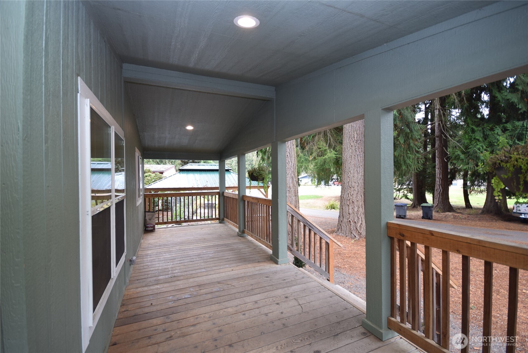 375 Dungeness Meadows Sequim, WA 98382 - Photo 3 of 27 a view of a porch with wooden floor and outdoor space