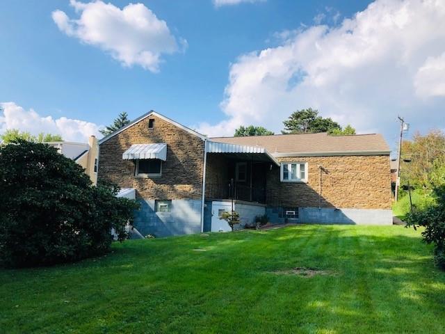 224 Streets Run Road Pittsburgh, PA 15236 - Photo 13 of 15 a front view of a house with a garden and plants