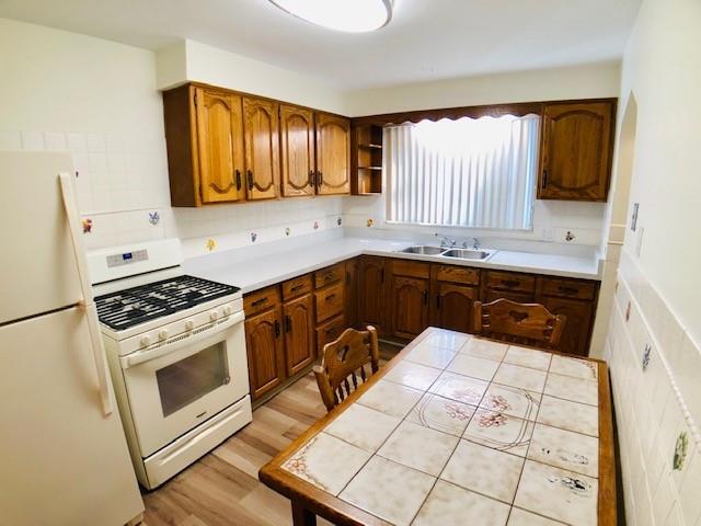 224 Streets Run Road Pittsburgh, PA 15236 - Photo 3 of 15 a kitchen with a sink stove top oven and cabinets