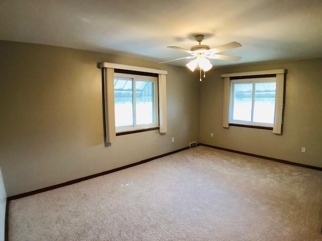224 Streets Run Road Pittsburgh, PA 15236 - Photo 8 of 15 an empty room with windows and chandelier fan