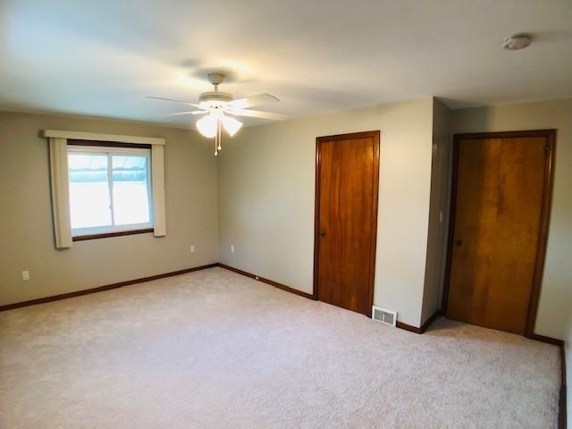 224 Streets Run Road Pittsburgh, PA 15236 - Photo 9 of 15 an empty room with windows and fan