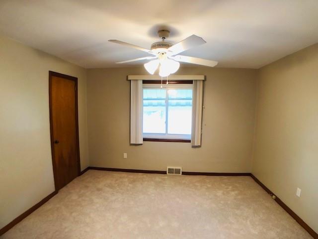 224 Streets Run Road Pittsburgh, PA 15236 - Photo 10 of 15 an empty room with a window and a fan