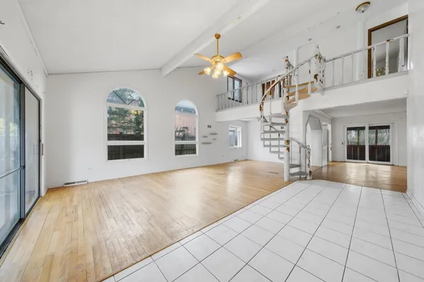 a view of a kitchen with furniture and floor to ceiling windows