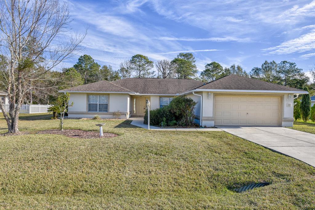 112 Hickory Loop Ocala, FL 34472 - Photo 1 of 1 front view of a house with a yard