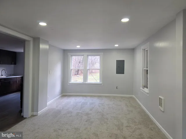 a view of room with window and ceiling fan