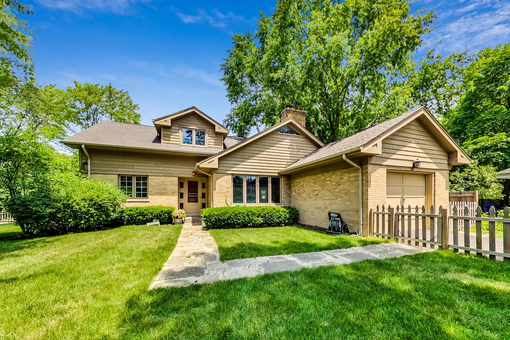 a front view of a house with yard