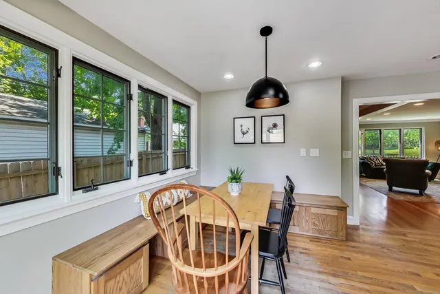 a view of a dining room with furniture window and wooden floor