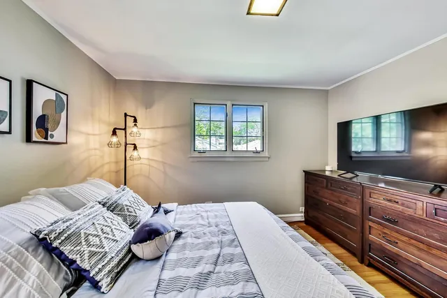 a bedroom with a bed and a dresser