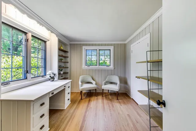 a view of a livingroom with furniture and a window