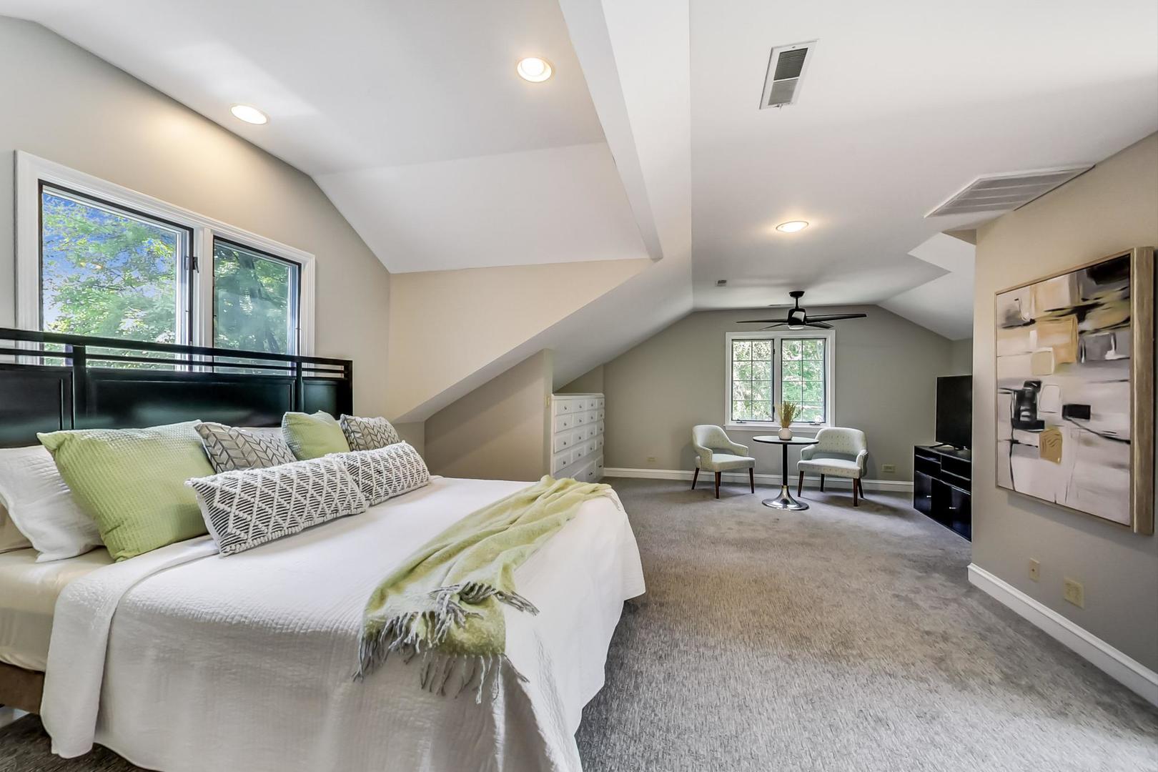 504 Illinois Road Wilmette, IL 60091 - Photo 18 of 43 a bedroom with a bed and furniture