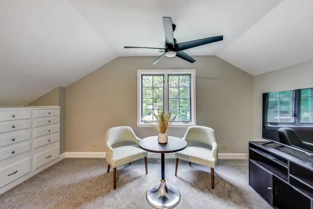 a workspace with furniture and a window