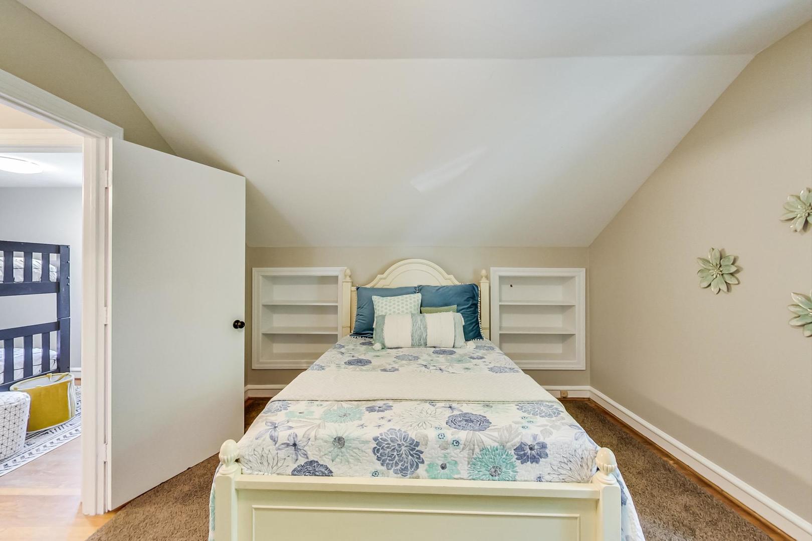 504 Illinois Road Wilmette, IL 60091 - Photo 26 of 43 a view of a bedroom with wooden floor and small space