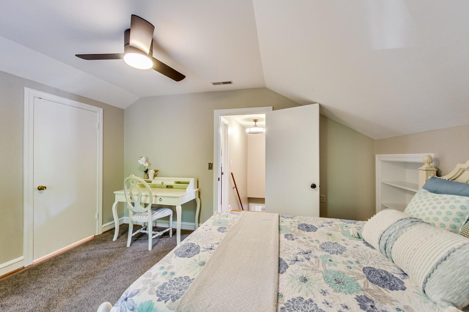 504 Illinois Road Wilmette, IL 60091 - Photo 27 of 43 a bedroom with a bed and a table in it