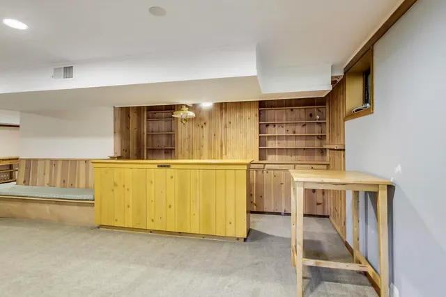 a bathroom with a sink mirror vanity and toilet