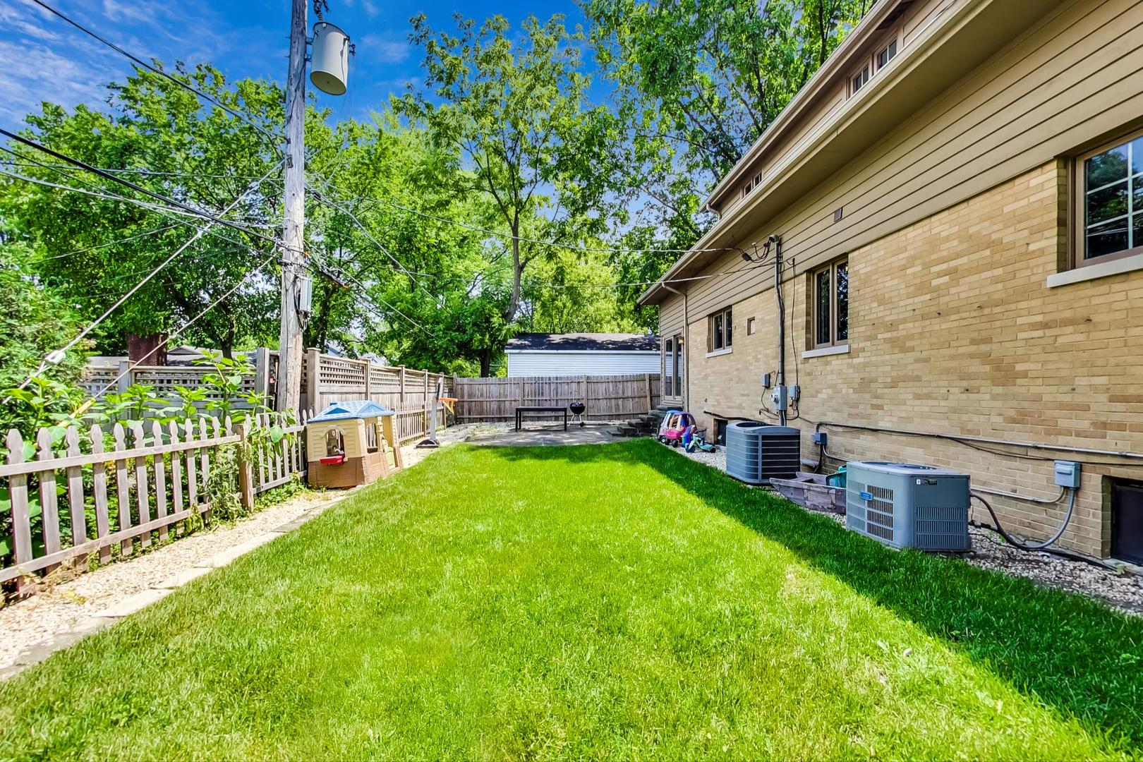 504 Illinois Road Wilmette, IL 60091 - Photo 40 of 43 a view of backyard with deck and garden