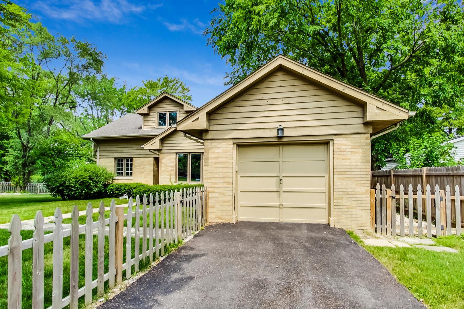 504 Illinois Road Wilmette, IL 60091 - Photo 43 of 43 a front view of a house with a garden