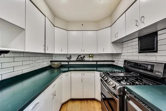 a kitchen with a cabinets and stove