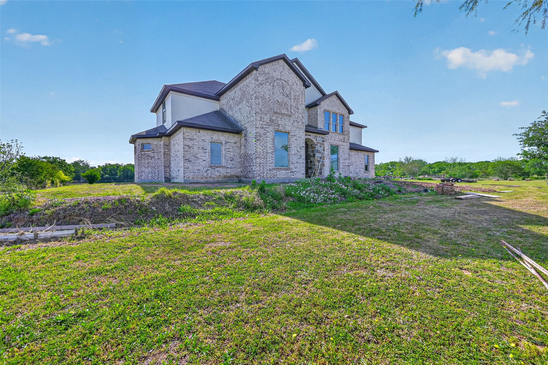 8023 Pool Hill Road Fulshear, TX 77441 - Photo 25 of 50 a view of a big house with a big yard and large trees
