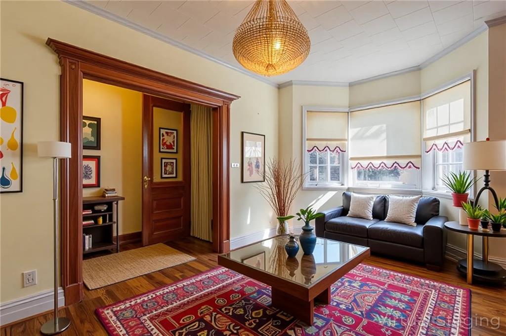 231 Monitor Street Brooklyn, NY 11222 - Photo 12 of 37 a living room with furniture and a wooden floor