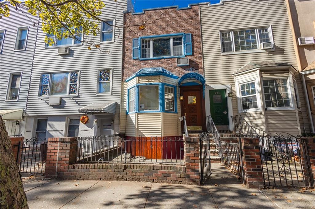 231 Monitor Street Brooklyn, NY 11222 - Photo 2 of 37 a front view of a house with iron fence