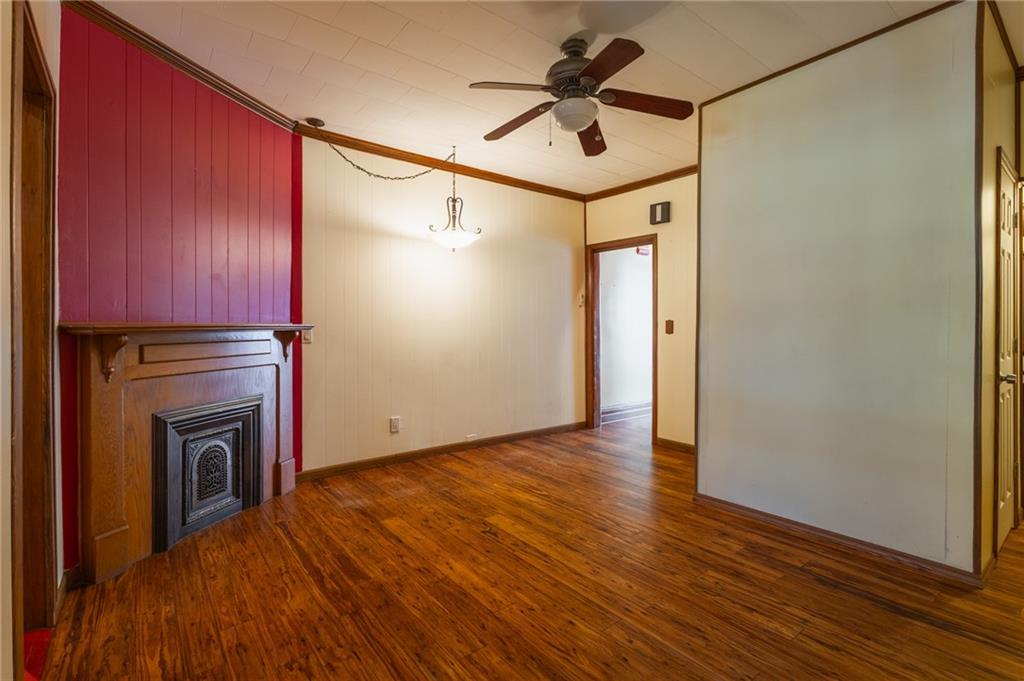 231 Monitor Street Brooklyn, NY 11222 - Photo 23 of 37 a view of empty room with wooden floor and fan
