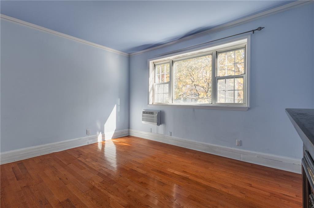 231 Monitor Street Brooklyn, NY 11222 - Photo 30 of 37 a view of an empty room with wooden floor and a window