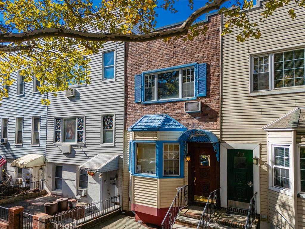 231 Monitor Street Brooklyn, NY 11222 - Photo 3 of 37 a front view of a house with a garden