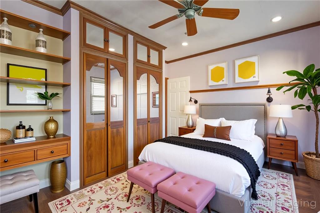 231 Monitor Street Brooklyn, NY 11222 - Photo 36 of 37 a bedroom with a bed and a chandelier