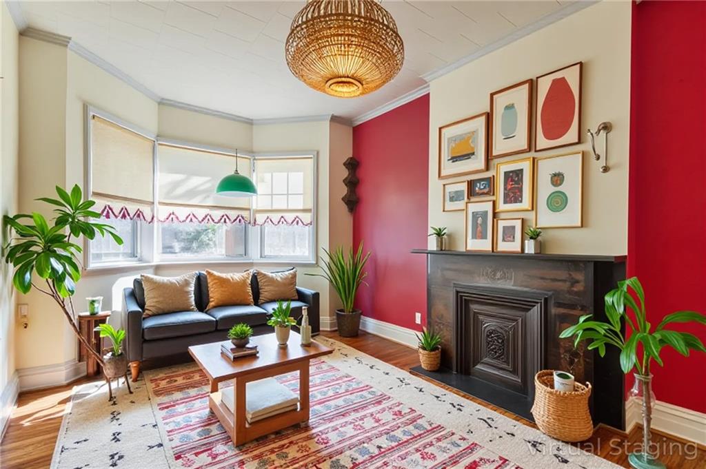 231 Monitor Street Brooklyn, NY 11222 - Photo 10 of 37 a living room with furniture and a fireplace