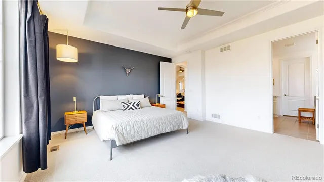 a bedroom with a bed and table