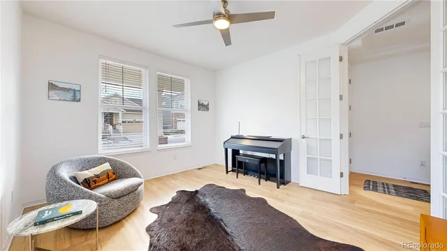 a bedroom with furniture and a piano