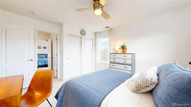 a bedroom with a bed and a chair