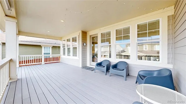 a view of a house with pool and wooden floor