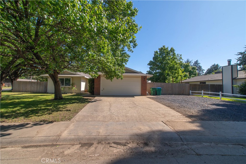 1 San Ramon Drive Chico, CA 95973 - Photo 41 of 42 a front view of a house with a yard and a garage