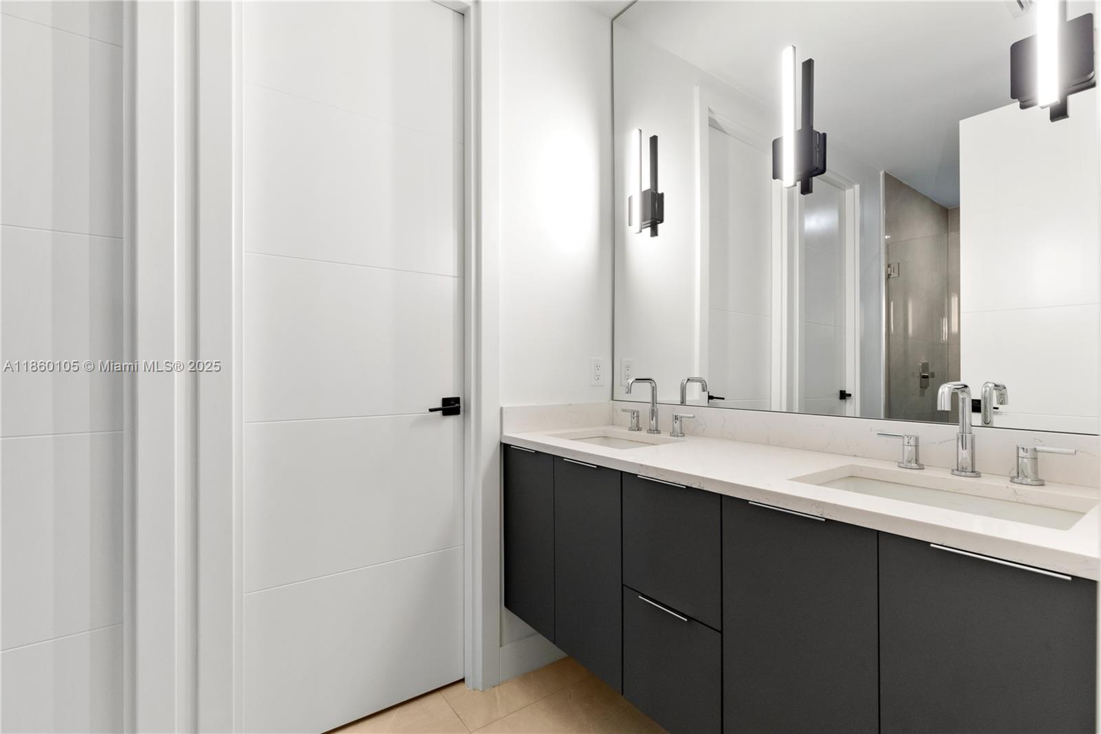 436 Southeast 12th Court Fort Lauderdale, FL 33316 - Photo 12 of 34 a bathroom with a double vanity sink and a mirror