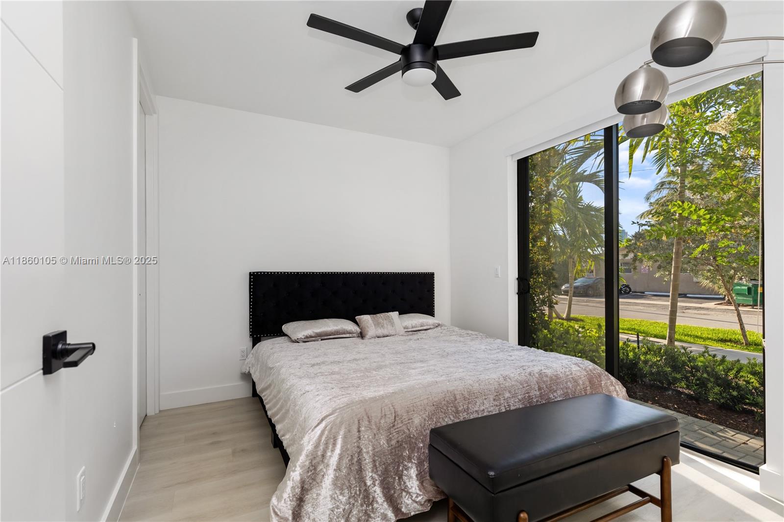 436 Southeast 12th Court Fort Lauderdale, FL 33316 - Photo 18 of 34 a bed sitting in a bedroom next to a window