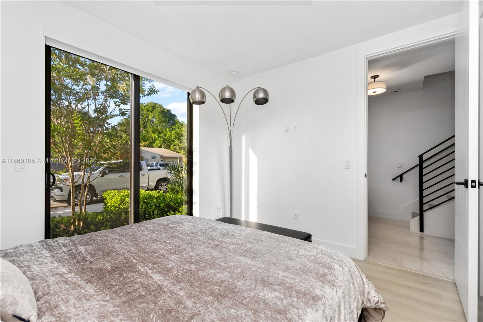 436 Southeast 12th Court Fort Lauderdale, FL 33316 - Photo 19 of 34 a bedroom with a bed and a large window