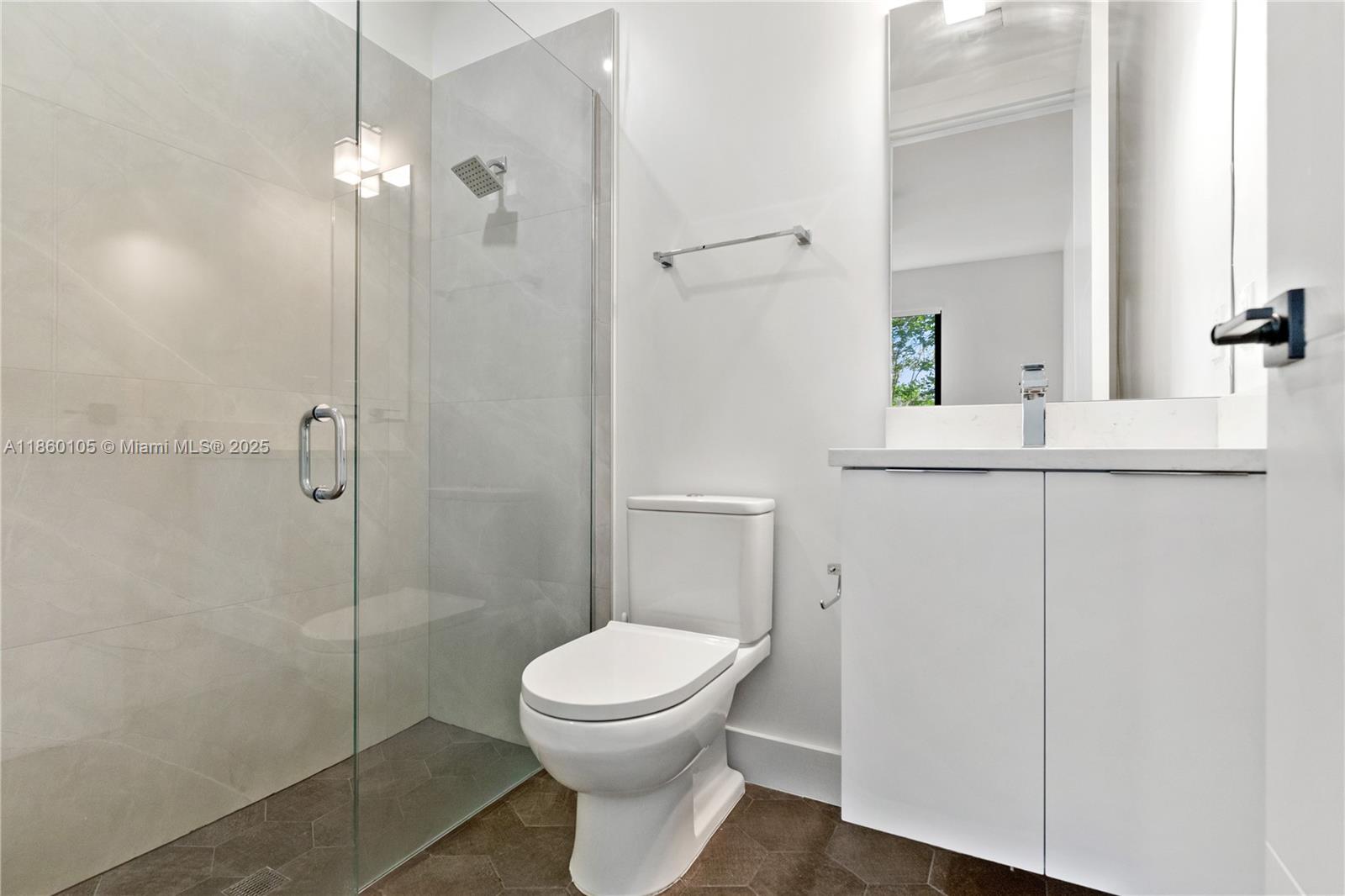 436 Southeast 12th Court Fort Lauderdale, FL 33316 - Photo 20 of 34 a bathroom with a toilet a sink and shower