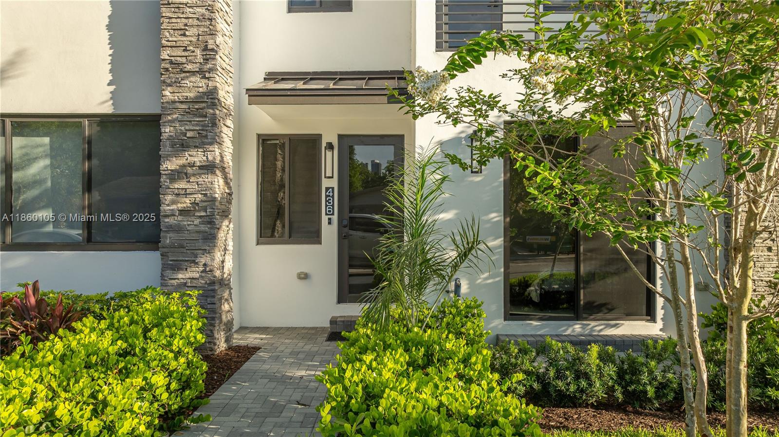 436 Southeast 12th Court Fort Lauderdale, FL 33316 - Photo 25 of 34 a front view of a house with a yard